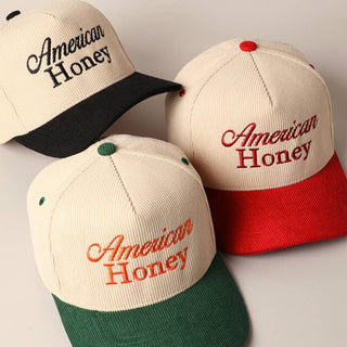 Three American Honey corduroy snapback caps in black, red, and green brim colorways