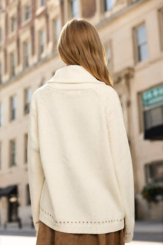 Cream shawl collar knit cardigan with jacquard detail and ribbed hem, back view
