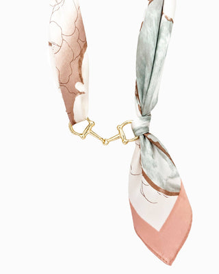 Silky scarf necklace in blush and sage floral print with gold horse bit hardware