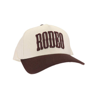 Cream and brown two-tone trucker cap with puff embroidered RODEO lettering