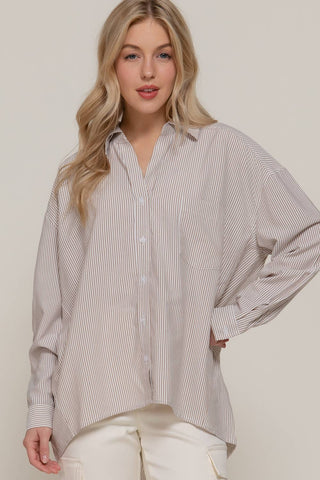 Oversized beige stripe button-down shirt with long dolman sleeves and chest pocket