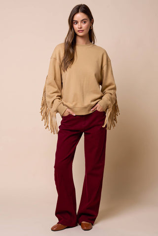 Lalavon camel fringe sleeve crew neck sweatshirt styled with burgundy wide-leg pants