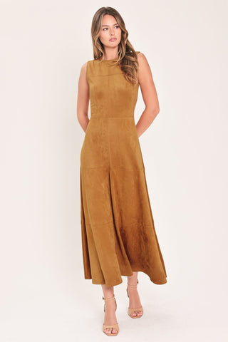 Model wearing a sleeveless faux suede midi dress with round neckline and flared circle skirt