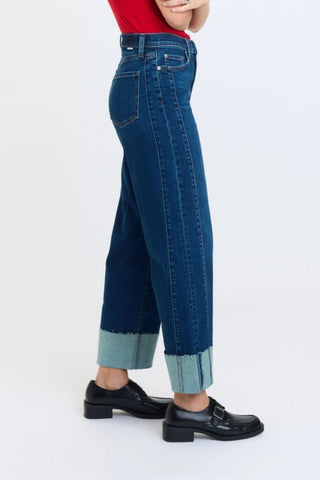 Side view of high rise wide leg ankle jeans with contrast cuffed hem on model