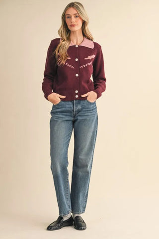 Burgundy western cardigan with pink collar, embroidery, and pearl buttons