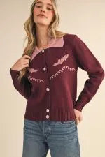 Burgundy western cardigan with pink contrast yoke and embroidered wing details