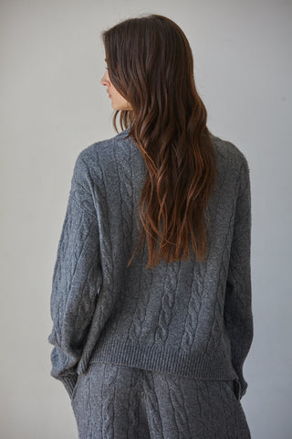 Dark heather grey cable-knit half zip sweater, back view, relaxed fit