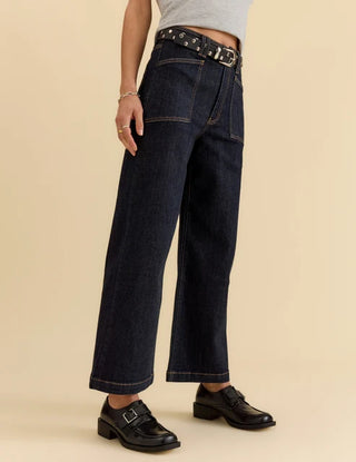 Dark rinse wide-leg ankle jeans with patch pockets and studded belt